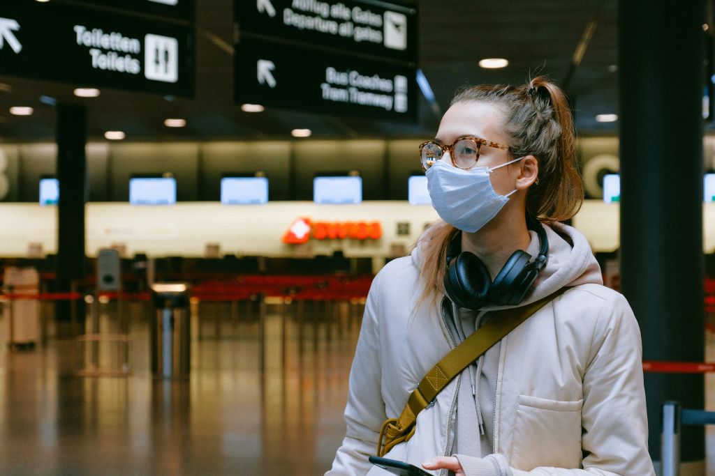 woman with face mask at airport